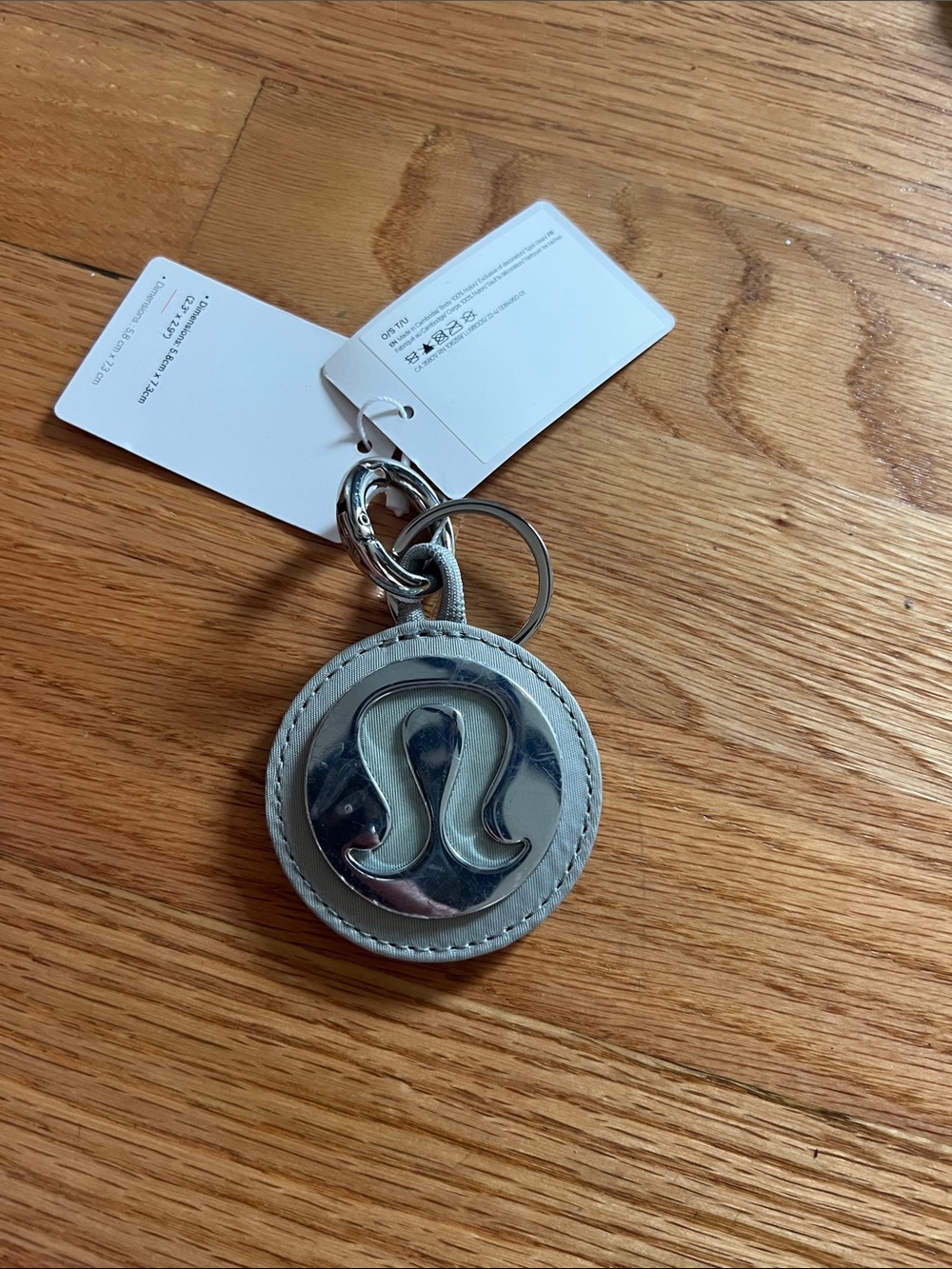 lululemon athletica Light Gray Leather Round Keychain with Silver Logo